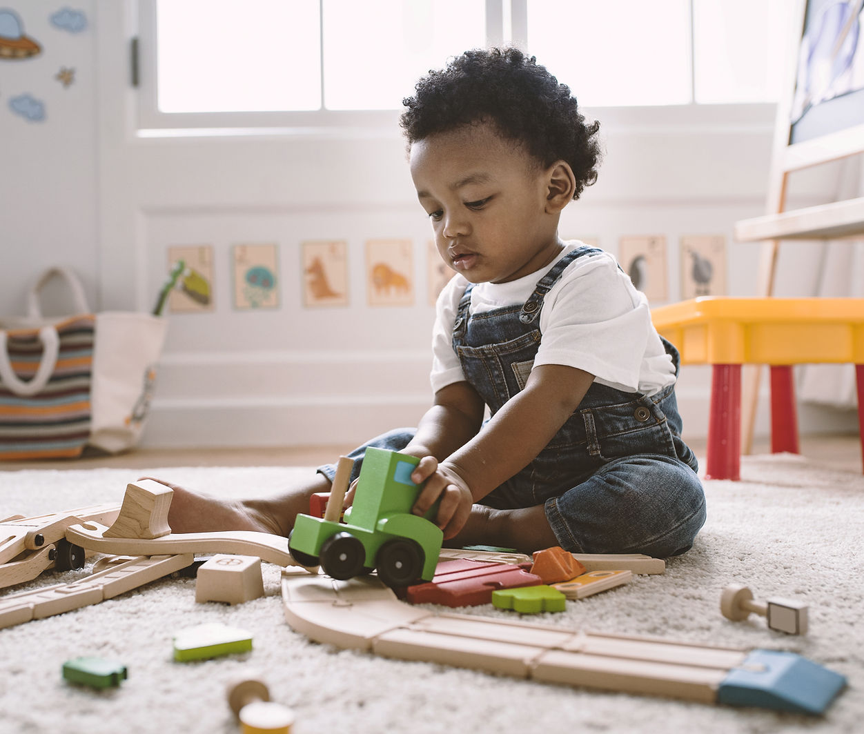 Infant playing with educational toys at licensed Falls Church VA daycare near Vienna